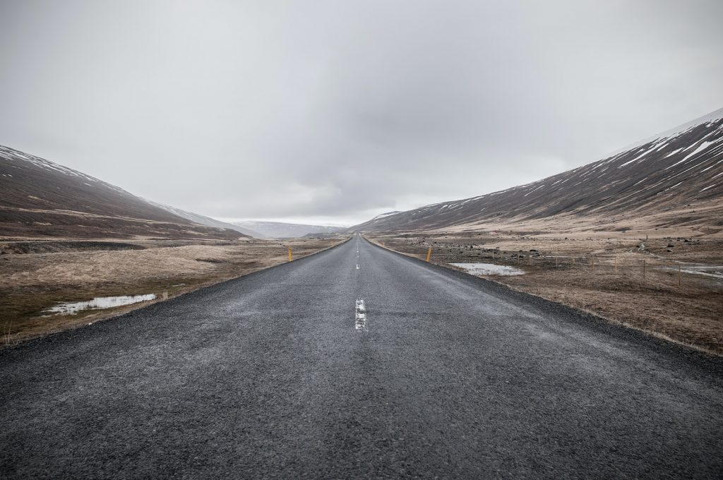 empty asphalt road through mountain